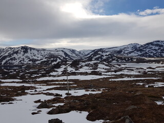 snowy mountain landscape in nordkapp in early spring