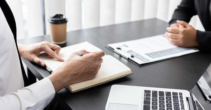 HR head is reading the resume and information about the candidate's history, Field employers are interviewing job applicants and negotiating agreements, Recruitment and job applications concept.