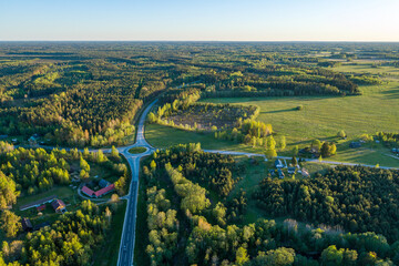 Aerial view of amazing sunset at summer season. Nature landscape. Fields, rivers and trees.