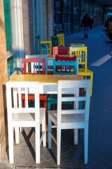 Sidewalk cafe colorful tables and chairs