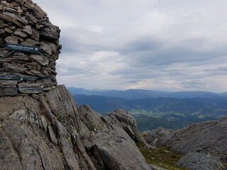 rocks in the mountains with forest landscape in the background