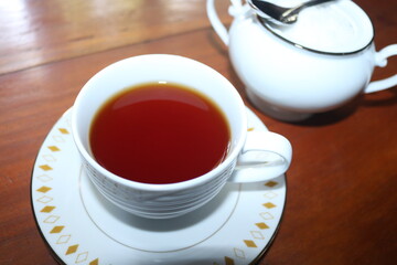 cup of tea with sugar cup and spoon