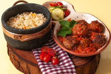delicious meatballs with tomato sauce and salad