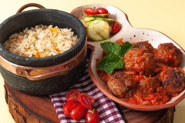 delicious meatballs with tomato sauce and salad