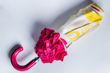 Umbrella on a white background. Umbrella spring theme. Umbrella with ruffles