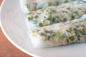 Close up of Vietnamese steamed rice noodle roll with pork inside. Selective focus.