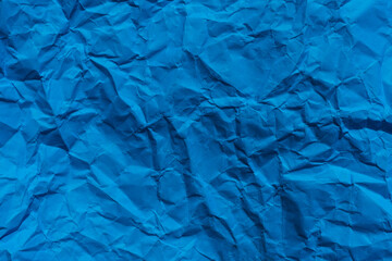  Sheet of blue crumpled  paper useful as a background.