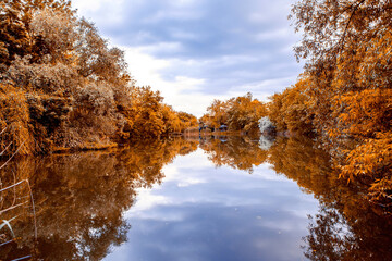 lake in autumn with reflection of the sky in the water