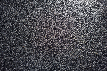 Texture of fresh and new black asphalt. Background of new asphalt
