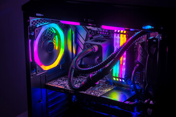 Fototapeta na wymiar Gaming PC with RGB LED lights on a computer, assembled with hardware components