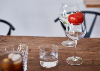 glasses on a wooden table with cherry iced coffee