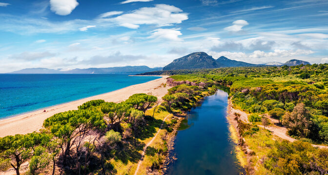 View from flying drone. Marvelous morning view of Osala Beach. Sunny summr scene of Sardinia island, Italy, Europe. Stunning seascape of Mediterranean sea. Traveling concept background.