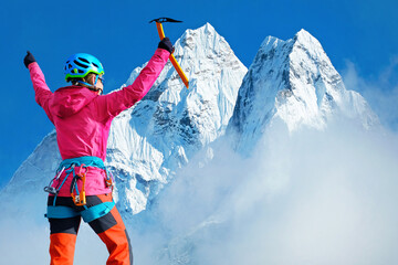 Climber at the top of mountain peak in Nepal, Everest region
