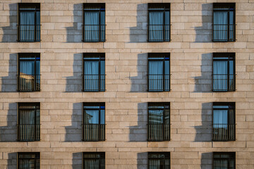 Fototapeta na wymiar Shadows of modern balconies