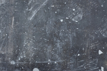 Black background. The texture of a black stone wall with white stains.