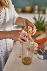 woman makes passion fruit lemonade