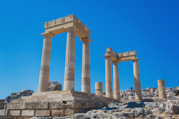 Fototapeta premium The ruins of the stoa psithyros at the Lindos acropolis on the Greek island of Rhodes