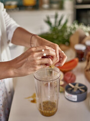 woman makes passion fruit lemonade