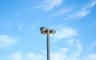 A lantern in the street against a blue sky