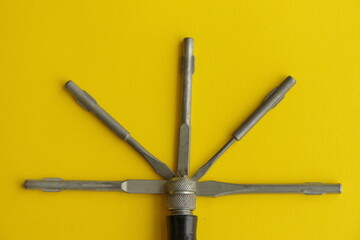Set of screwdriver on a yellow background