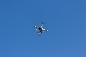 Quadrocopter in the sky to shoot video