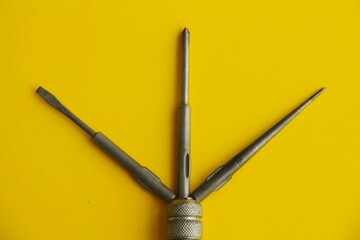 Naklejka premium Set of screwdriver on a yellow background