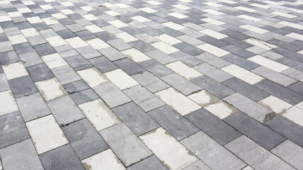 Concrete paving slabs. Abstract gray paving slab texture background. Paving stones of rectangular shape close-up.