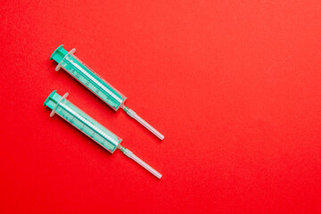 Top view of medical syringes on colorful background. Health care concept with copy space