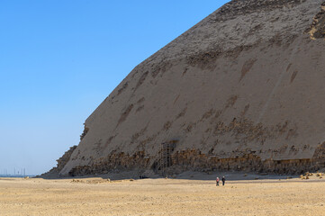 Bent Pyramid at Dahshur Necropolis in an arid landscape compare scale with human -Cairo -Egypt