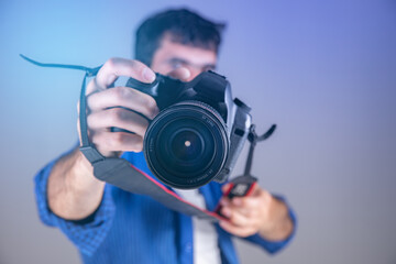 photographer hand camera in studio - obrazy, fototapety, plakaty
