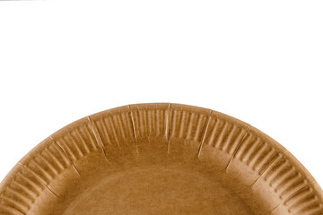 Eco natural plate with empty space. Disposable ecological utensils on white background. Sustainability of planet. Closeup isolated cardboard plate made of fiber of bamboo and bagasse.