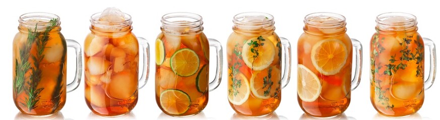 Iced tea with lemon, lime, thyme, rosemary in a mason jars, isolated