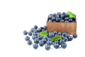 blueberry berries are in the wood box isolated on white background