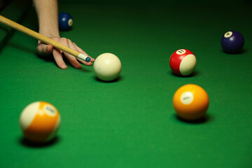 billiard background with color balls and cues on green table