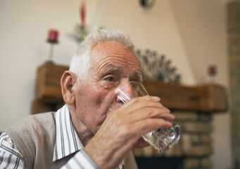 Old man drinking water