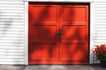 Bright red door and flowers near it
