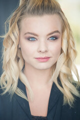 Fototapeta premium Pretty blonde with blue eyes and wavy hair