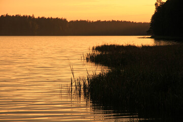 Sunset over Mikaszewo lake in Augustow Primeval Forest, Suwalki Region in Poland