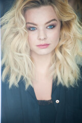 Naklejka premium Pretty blonde with blue eyes and wavy hair