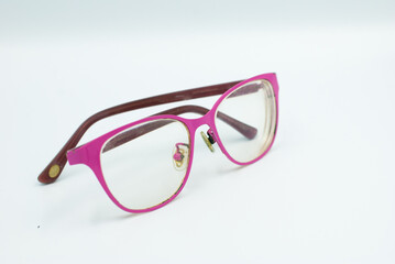 Pink glasses on a white background