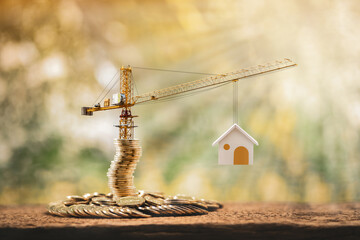 Stacking gold coins with increase and tower crane and hoist brake solutions with build new house in...