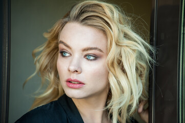 Pretty blonde with blue eyes and wavy hair