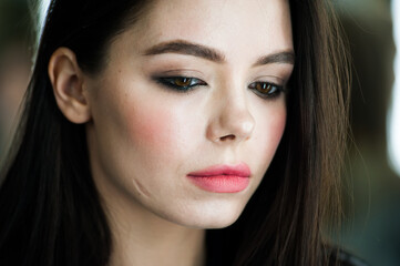 Portrait of beautiful young woman with makeup 