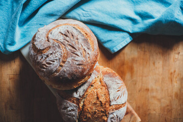 Classic sourdough bread, Artisan homemade bread on wood table, Cooking at home