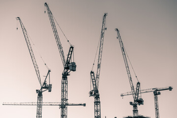 Amsterdam industrial area skyline with red cranes , high office buildings , water  - developing area 