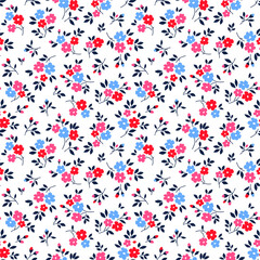 Vintage floral background. Seamless vector pattern for design and fashion prints. Flowers pattern with small red and blue flowers on a white background. Ditsy style.