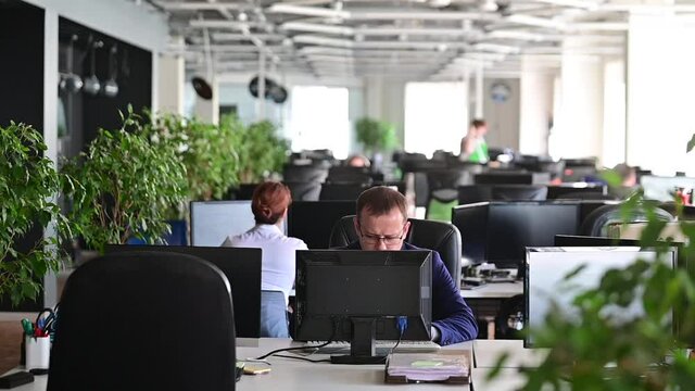 A man freaks out and gets depressed from a mistake and breaks the keyboard on the monitor. The male manager is angry and crashes the computer. Office clerk is stressed at work. Unstable psyche.