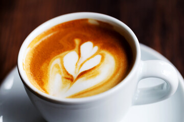 Cup of coffee. Morning atmospheric lighting, fashionable trendy spot soft focus. Preparation for design creative menu.