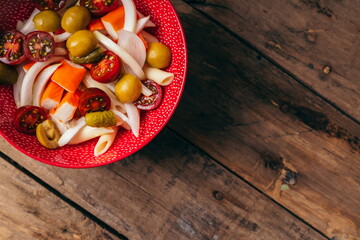 Pasta salad ready to eat on an old wooden table as a background