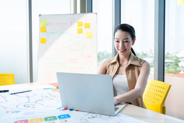 Businesswoman and Business team in video conference for protection covid-19.woman watching laptop webinar video course at home office.Webinar,social distancing,e learning and seminar online Concept.